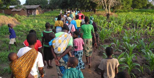 Villagers walking towards village